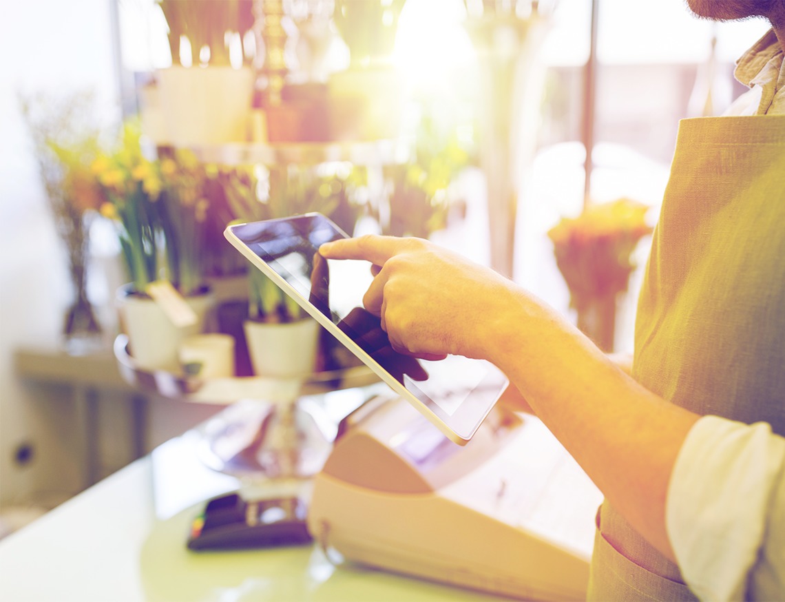 close-up-of-man-with-tablet-pc-at-flower-shop-PAGQQBQ.png 